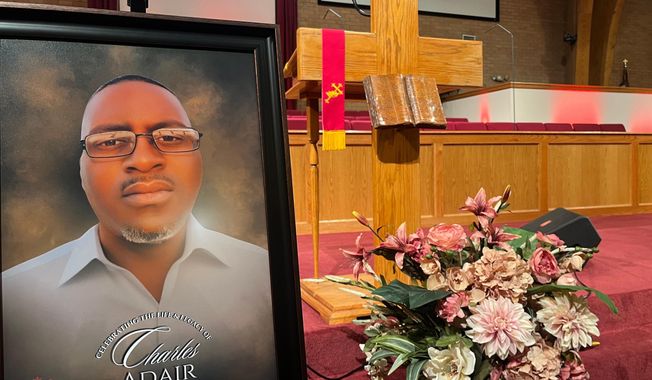 FILE - A photo of Charles Adair, a man killed when a deputy kneeled on his back in a Kansas jail, is displayed Sunday, Sept. 23, 2025, at a news conference held by his family and their attorneys at Friendship Baptist Church in Kansas City, Mo. (AP Photo/Heather Hollingsworth, File)