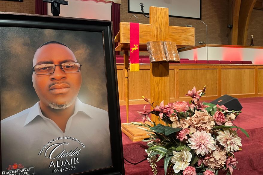 FILE - A photo of Charles Adair, a man killed when a deputy kneeled on his back in a Kansas jail, is displayed Sunday, Sept. 23, 2025, at a news conference held by his family and their attorneys at Friendship Baptist Church in Kansas City, Mo. (AP Photo/Heather Hollingsworth, File)