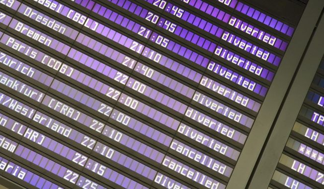 Screens at the Munich Airport show diverted and canceled flights after the airport suspended operations due to possible new drone sightings Friday, Oct. 3, 2025, in Munich. (Enrique Kaczor/dpa via AP)