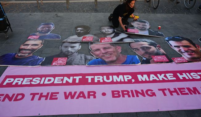 Relatives and supporters of hostages held by Hamas in the Gaza Strip calling for their immediate release and an end of the ongoing war, in front of the U.S. Embassy branch office in Tel Aviv, Israel, Monday, Sept. 29, 2025, During the meeting between U.S. President Donald Trump and Israeli Prime Minister Benjamin Netanyahu in the White House. (AP Photo/Ariel Schalit)