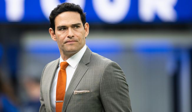 Mark Sanchez walks on the field before an NFL football game between the Los Angeles Rams and the Jacksonville Jaguars Sunday, Dec. 5, 2021, in Inglewood, Calif. (AP Photo/Kyusung Gong, File)