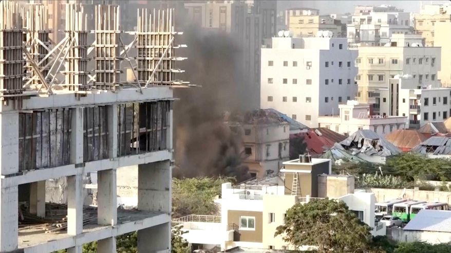 Smoke fills the sky as explosions and heavy gunfire erupted near Somalia’s presidential palace in an attack by a militant group in Mogadishu, Somalia on Saturday, Oct. 4, 2025. (AP Photo)