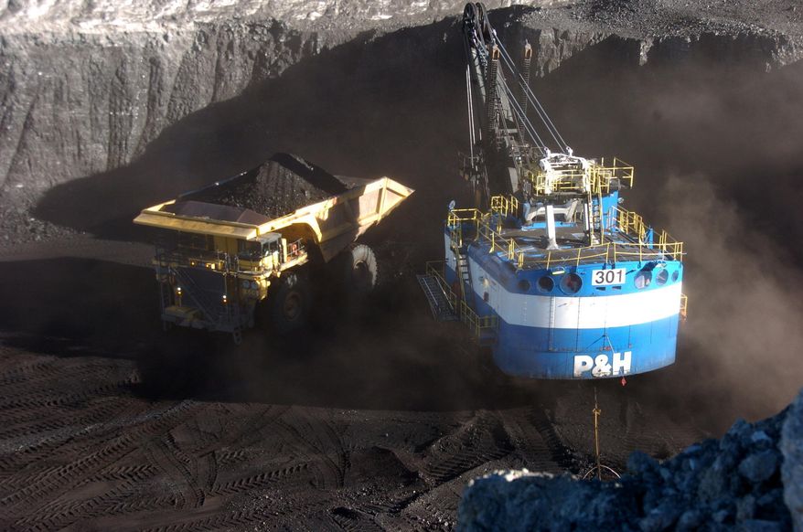 A haul truck is seen after being loaded with coal by a mechanized shovel at the Spring Creek mine, in this Nov. 15, 2016 photo, near Decker, Mont. (AP Photo/Matthew Brown) ** FILE **