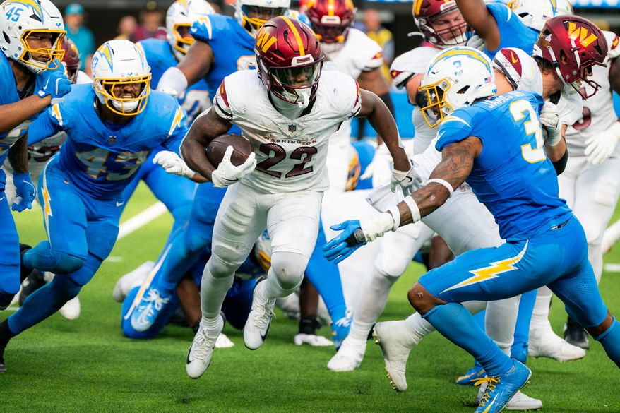 Washington Commanders Running Back Jacory Crosket-Merritt (22) breaks through Los Angeles Chargers line at SoFi Stadium in Inglewood California. The Washington Commanders defeated the Los Angeles Chargers 27-10 during NFL Week 5 on October 5th, 2025. (Photo by Jordan Sabillo for Washington Times)
