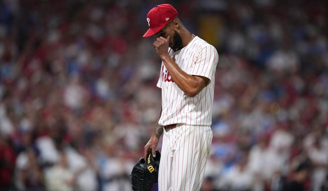Philadelphia Phillies pitcher Cristopher Sánchez wipes his face after being pulled during the sixth inning in Game 1 of baseball's National League Division Series against the Los Angeles Dodgers, Saturday, Oct. 4, 2025, in Philadelphia. (AP Photo/Matt Slocum)