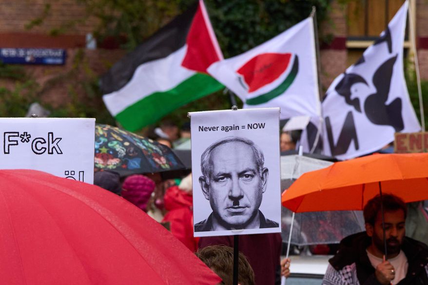 Thousands of protesters march demanding their government do more to halt Israel's campaign in Gaza, during a demonstration in Amsterdam, Netherlands, Sunday, Oct. 5, 2025. (AP Photo/Peter Dejong)