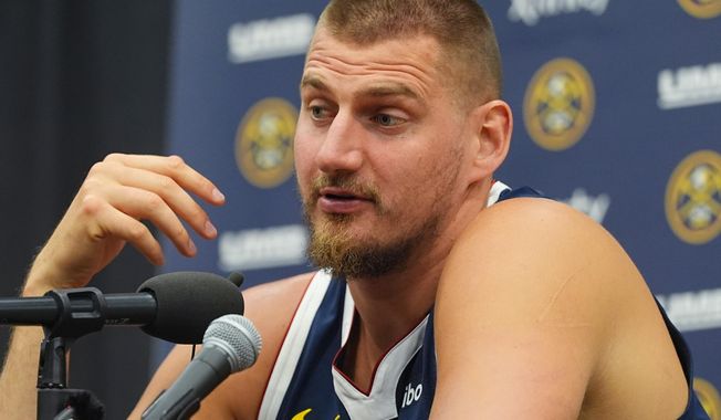 Denver Nuggets center Nikola Jokic responds to questions during an NBA basketball media day news conference Monday, Sept. 29, 2025, in Denver. (AP Photo/David Zalubowski)