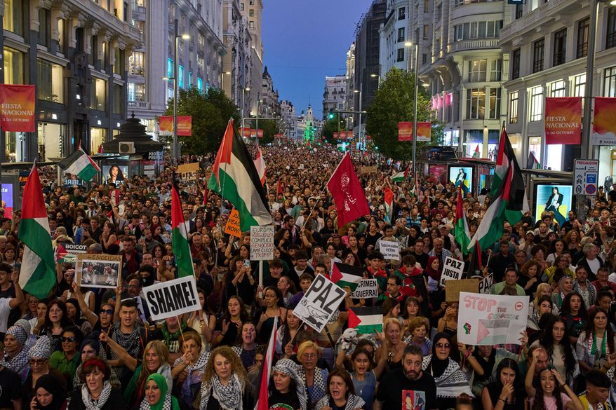 Pro-Palestinian demonstrators rally during a protest in Madrid, Spain, Saturday, Oct. 4, 2025, calling for an end to the war in Gaza. (AP Photo/Bernat Armangue)