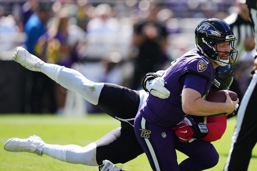 during the first half of an NFL football game, Sunday, Oct. 5, 2025, in Baltimore. (AP Photo/Stephanie Scarbrough)