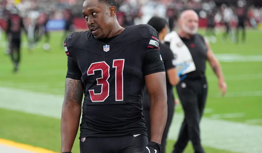 Arizona Cardinals running back Emari Demercado (31) reacts on the sideline after fumbling the ball out of the end zone on a touchdown run during the second half of an NFL football game against the Tennessee Titans, Sunday, Oct. 5, 2025, in Glendale, Ariz. (AP Photo/Ross D. Franklin)