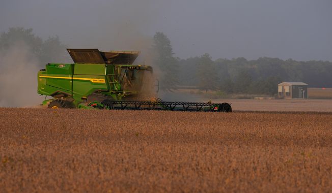 Soybeans are harvested on the Warpup Farm in Warren, Ind., Wednesday, Sept. 17, 2025. (AP Photo/Michael Conroy) ** FILE **