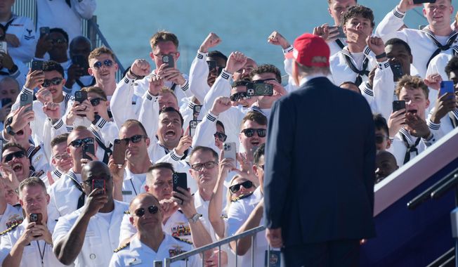 President Donald Trump arrives to speak during a celebration for the 250th anniversary of the U.S. Navy aboard the USS Harry S. Truman at Naval Station Norfolk, Sunday Oct. 5, 2025 in Norfolk, Va. (AP Photo/Steve Helber)