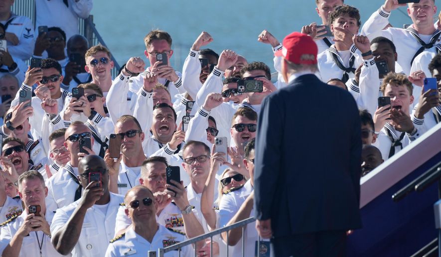 President Donald Trump arrives to speak during a celebration for the 250th anniversary of the U.S. Navy aboard the USS Harry S. Truman at Naval Station Norfolk, Sunday Oct. 5, 2025 in Norfolk, Va. (AP Photo/Steve Helber)
