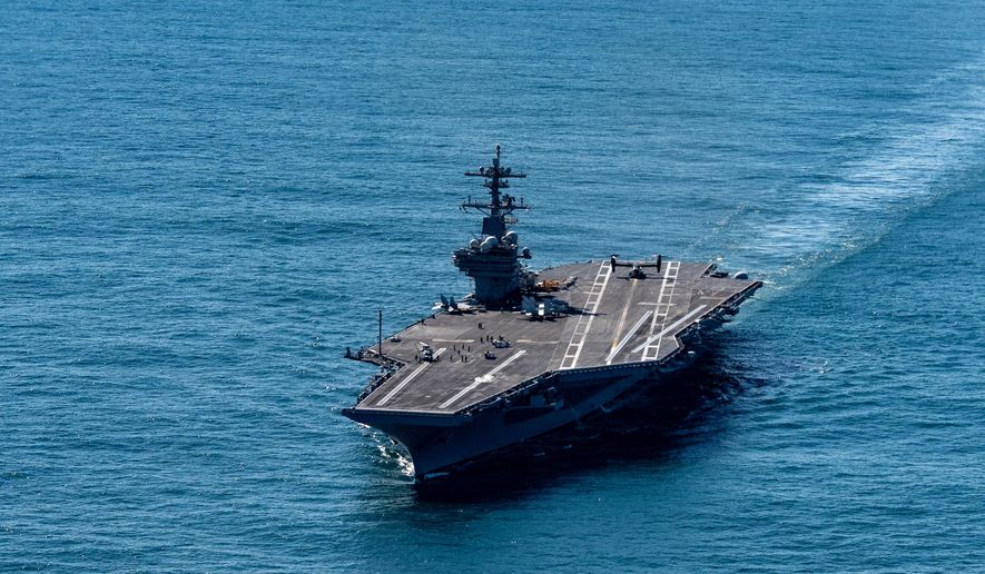The USS George H.W. Bush aircraft carrier sails in the Atlantic Ocean off the coast of Norfolk, Va., Saturday, Oct. 4, 2025. (AP Photo/Alex Brandon, Pool)