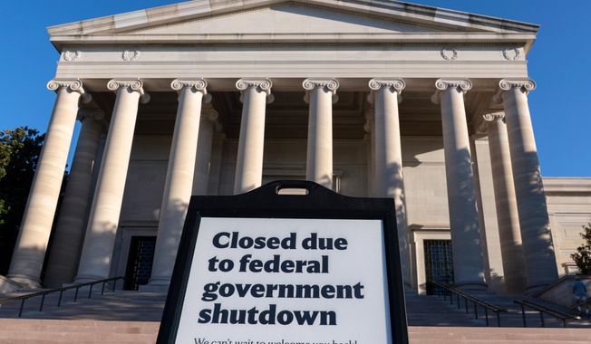 A sign that reads "Closed due to federal government shutdown," is seen outside of the National Gallery of Art on the 6th day of the government shutdown, in Washington, Monday, Oct. 6, 2025. (AP Photo/Jose Luis Magana)