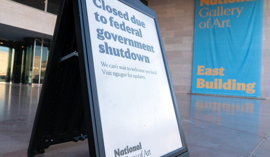 A sign that reads "Closed due to federal government shutdown," is seen outside of the National Gallery of Art on the 6th day of the government shutdown, in Washington, Monday, Oct. 6, 2025. (AP Photo/Jose Luis Magana)