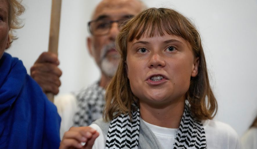 Swedish activist Greta Thunberg speaks as she arrives at the Eleftherios Venizelos International Airport in Athens, Monday, Oct. 6, 2025, after being deported from Israel for taking part in a Gaza-bound aid flotilla. (AP Photo/Petros Giannakouris) ** FILE **