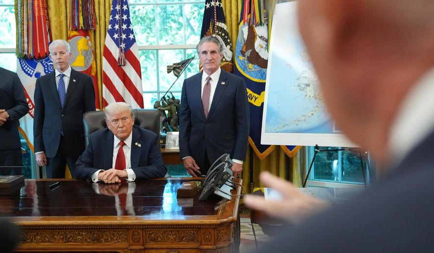 President Donald Trump speaks to reporters before signing an executive order in the Oval Office at the White House, Monday, Oct. 6, 2025, in Washington, as Energy Secretary Chris Wright and Interior Secretary Doug Burgum listen. (AP Photo/Jacquelyn Martin)