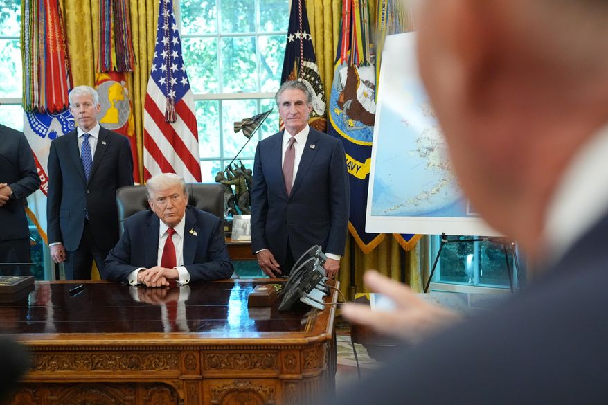 President Donald Trump speaks to reporters before signing an executive order in the Oval Office at the White House, Monday, Oct. 6, 2025, in Washington, as Energy Secretary Chris Wright and Interior Secretary Doug Burgum listen. (AP Photo/Jacquelyn Martin)