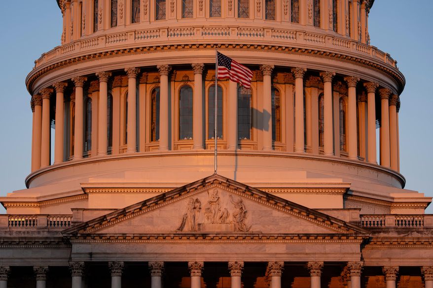 The Capitol is illuminated at dawn in Washington, Monday, Oct. 6, 2025. (AP Photo/J. Scott Applewhite)