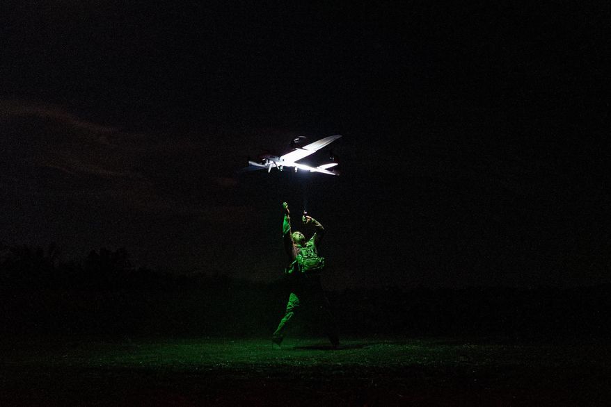 A Ukrainian serviceman with the Safari Unit of the Liut Brigade launches a reconnaissance drone at the frontline in the Donetsk region, Ukraine, on Sept. 6, 2025. (AP Photo/Vasilisa Stepanenko)