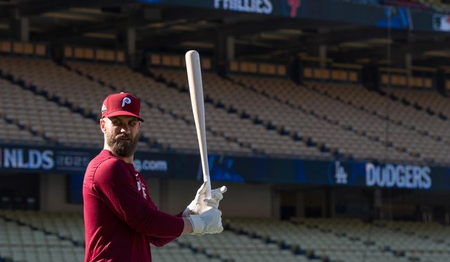 Philadelphia Phillies' Bryce Harper gets ready for batting practice Tuesday, Oct. 7, 2025, in Los Angeles, the day before Game 3 of baseball's National League Division Series against the Los Angeles Dodgers. (AP Photo/Jae C. Hong)