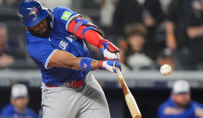 Toronto Blue Jays' Vladimir Guerrero Jr. connects for a single to drive in a run against the New York Yankees during the first inning of Game 4 of baseball's American League Division Series, Wednesday, Oct. 8, 2025, in New York. (AP Photo/Frank Franklin II)
