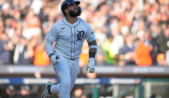 Detroit Tigers' Gleyber Torres watches his solo home run during the seventh inning in Game 4 of baseball's American League Division Series against the Seattle Mariners Wednesday, Oct. 8, 2025, in Detroit. (AP Photo/Paul Sancya)