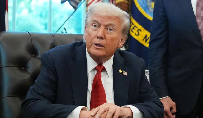 President Donald Trump speaks to reporters before signing an executive order in the Oval Office at the White House, Monday, Oct. 6, 2025, in Washington. (AP Photo/Jacquelyn Martin)