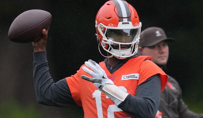 Cleveland Browns quarterback Shedeur Sanders (12) attends an NFL football practice at The Grove in Watford, England, Friday, Oct. 3, 2025. (AP Photo/Kin Cheung)