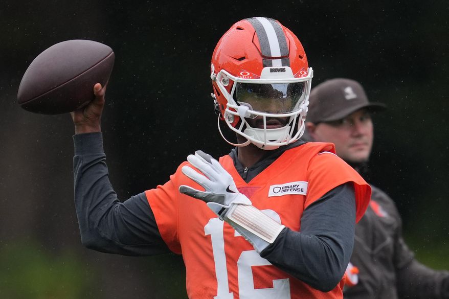 Cleveland Browns quarterback Shedeur Sanders (12) attends an NFL football practice at The Grove in Watford, England, Friday, Oct. 3, 2025. (AP Photo/Kin Cheung)
