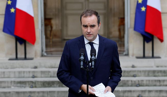 French outgoing Prime Minister Sebastien Lecornu makes a statement at the Hotel Matignon, the Prime Minister's residence, Wednesday, Oct. 8, 2025. (Stephanie Lecocq, Pool via AP)