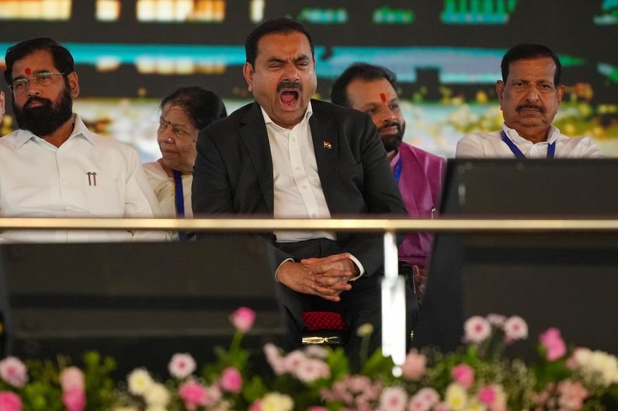 Chairman Adani Group, Gautam Adani yawns during the inauguration ceremony of the Navi Mumbai International Airport in Navi Mumbai, India, Wednesday, Oct. 8, 2025. (AP Photo/Rafiq Maqbool)