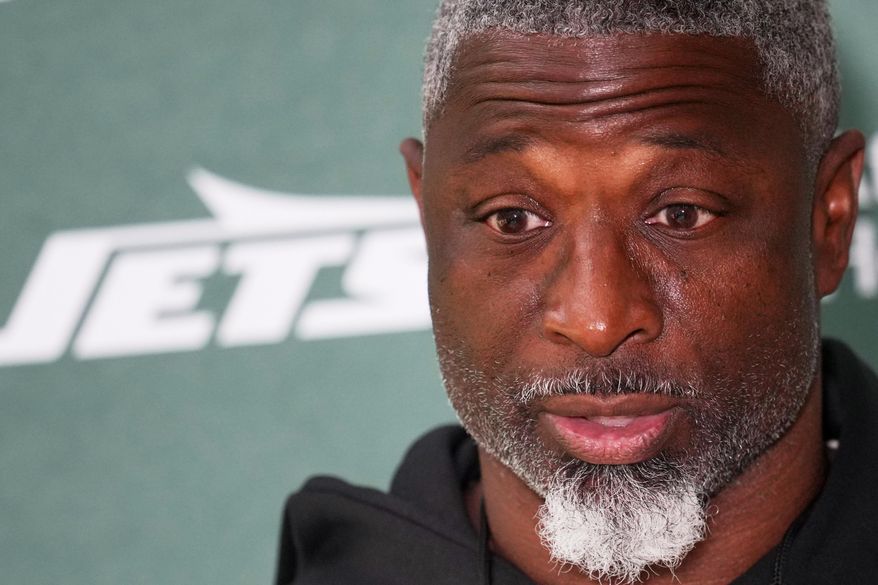 New York Jets head coach Aaron Glenn speaks during a press conference at an NFL football practice at The Grove in Watford, England, Wednesday, Oct. 8, 2025. (AP Photo/Kin Cheung)