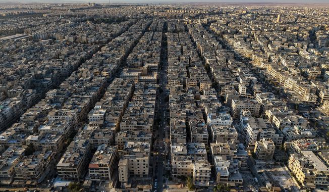 A general view shows the Sheikh Maqsoud neighborhood of Aleppo, Syria, Tuesday, Oct. 7, 2025. (AP Photo/Omar Albam)