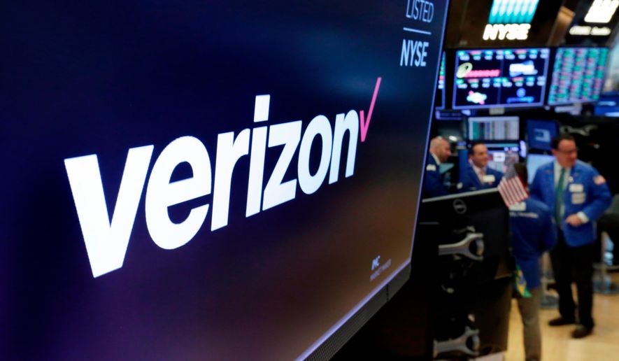 FILE - This April 23, 2018, file photo shows the logo for Verizon above a trading post on the floor of the New York Stock Exchange. (AP Photo/Richard Drew, File)