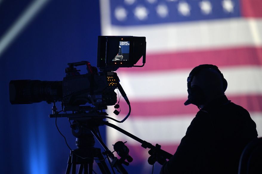 A cameraman works as former President Donald Trump speaks during the Turning Point USA Student Action Summit, Saturday, July 23, 2022, in Tampa, Fla. (AP Photo/Phelan M. Ebenhack)