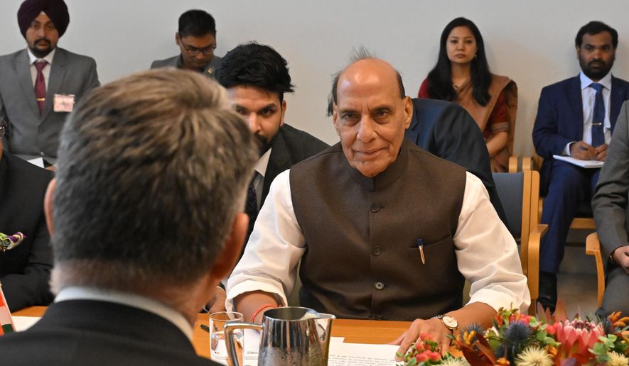 India's Defense Minister Rajnath Singh, right, sits with his Australian counterpart Richard Marles, back to camera, at Parliament House in Canberra, Australia, Thursday, Oct. 9, 2025. (Mick Tsikas/AAP Image via AP) ** FILE **