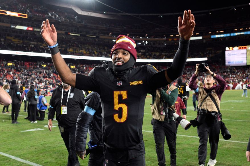 Washington Commanders quarterback Jayden Daniels (5) leaves the field after an 18-15 win over the Chicago Bears in an NFL football game, Oct. 27, 2024, in Landover, Md. (AP Photo/Nick Wass, File)