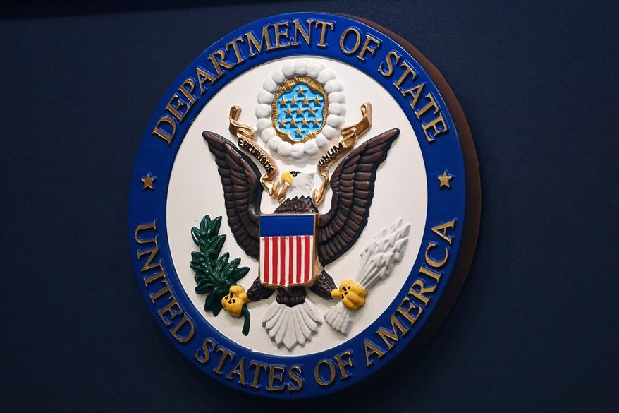 The State Department seal is seen on the briefing room lectern at the State Department in Washington, Jan. 31, 2022. (Mandel Ngan, Pool via AP, File)