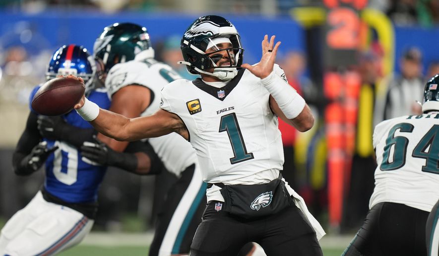 Philadelphia Eagles' Jalen Hurts plays during the first half of an NFL football game against the New York Giants Thursday, Oct. 9, 2025, in East Rutherford, N.J. (AP Photo/Seth Wenig)