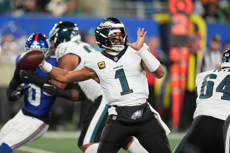 Philadelphia Eagles' Jalen Hurts plays during the first half of an NFL football game against the New York Giants Thursday, Oct. 9, 2025, in East Rutherford, N.J. (AP Photo/Seth Wenig)