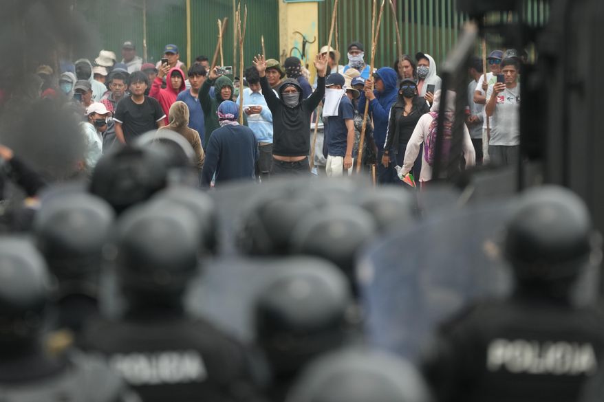 Soldiers face off with demonstrators during protests over the elimination of the diesel subsidy by President Daniel Noboa's government, in Calderon, Ecuador, Thursday, Oct. 9, 2025. (AP Photo/Dolores Ochoa)