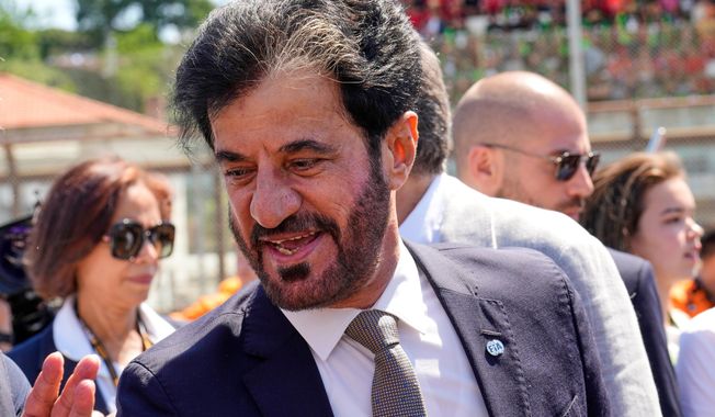FILE - Mohammed Ben Sulayem President of the Federation Internationale de l'Automobile is on the starting grid before the Italian Emilia Romagna Formula One Grand Prix, at the Enzo and Dino Ferrari racetrack in Imola, Italy, Sunday, May 18, 2025. (AP Photo/Luca Bruno, File)
