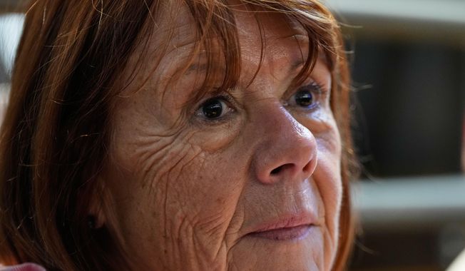 Gisele Pelicot sits in the courtroom during the appeals trial in the case of a man challenging his conviction, less than a year after the landmark verdict in a drugging and rape trial that shook France Thursday, Oct. 9, 2025 in Nimes, southern France. (AP Photo/Lewis Joly)