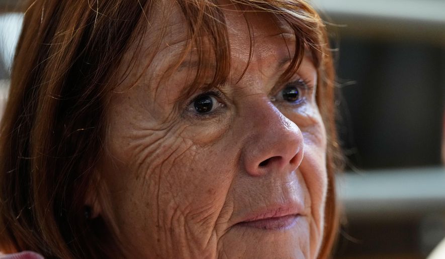 Gisele Pelicot sits in the courtroom during the appeals trial in the case of a man challenging his conviction, less than a year after the landmark verdict in a drugging and rape trial that shook France Thursday, Oct. 9, 2025 in Nimes, southern France. (AP Photo/Lewis Joly)