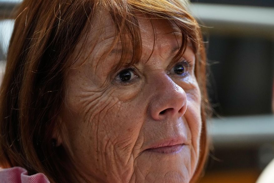 Gisele Pelicot sits in the courtroom during the appeals trial in the case of a man challenging his conviction, less than a year after the landmark verdict in a drugging and rape trial that shook France Thursday, Oct. 9, 2025 in Nimes, southern France. (AP Photo/Lewis Joly)