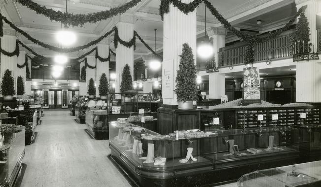 This 1940s photo provided by the Detroit Historical Society shows the J.L. Hudson Company Department Store retail floor decorated for the holidays in Detroit. (Davis B. Hillmer via AP)
