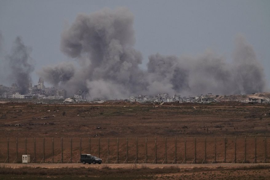 Smoke rises to the sky following an Israeli military strike in the Gaza Strip, as seen from southern Israel, Thursday, Oct. 9, 2025, following the announcement that Israel and Hamas have agreed to the first phase of a peace plan to pause the fighting. (AP Photo/Ariel Schalit)