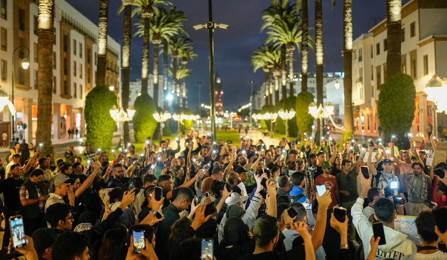 People take part in a youth-led protest against corruption and calling for education and healthcare reforms, in Rabat, Morocco, Thursday, Oct. 9, 2025. (AP Photo/Mosa'ab Elshamy)